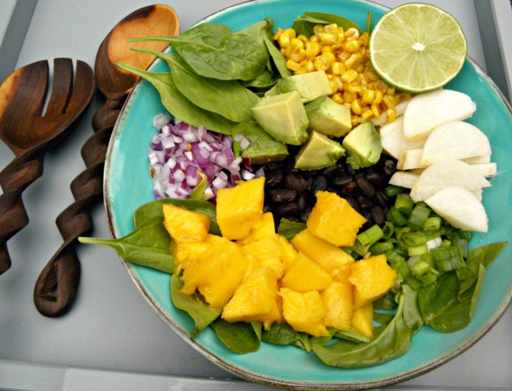 Indo- Mexican fusion salad recipe with curried beans, mango, jicama an dspinach to nmae a few :)