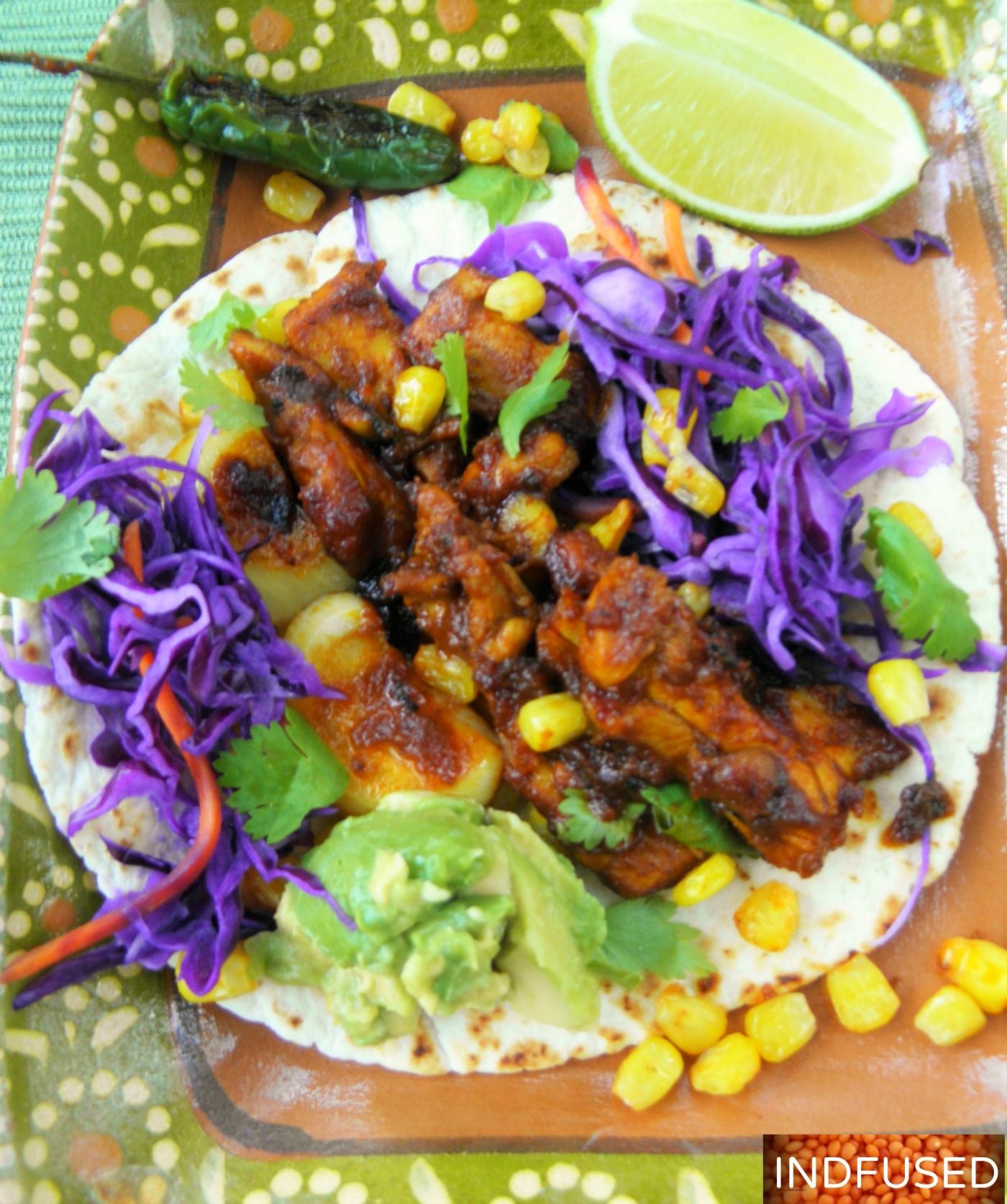 Easy , figure friendly recipe. Tender chicken coated with Indian vindaloo sauce, gluten free,Indo mexican fusion one pan meal with guacamole and red cabbage toppings.