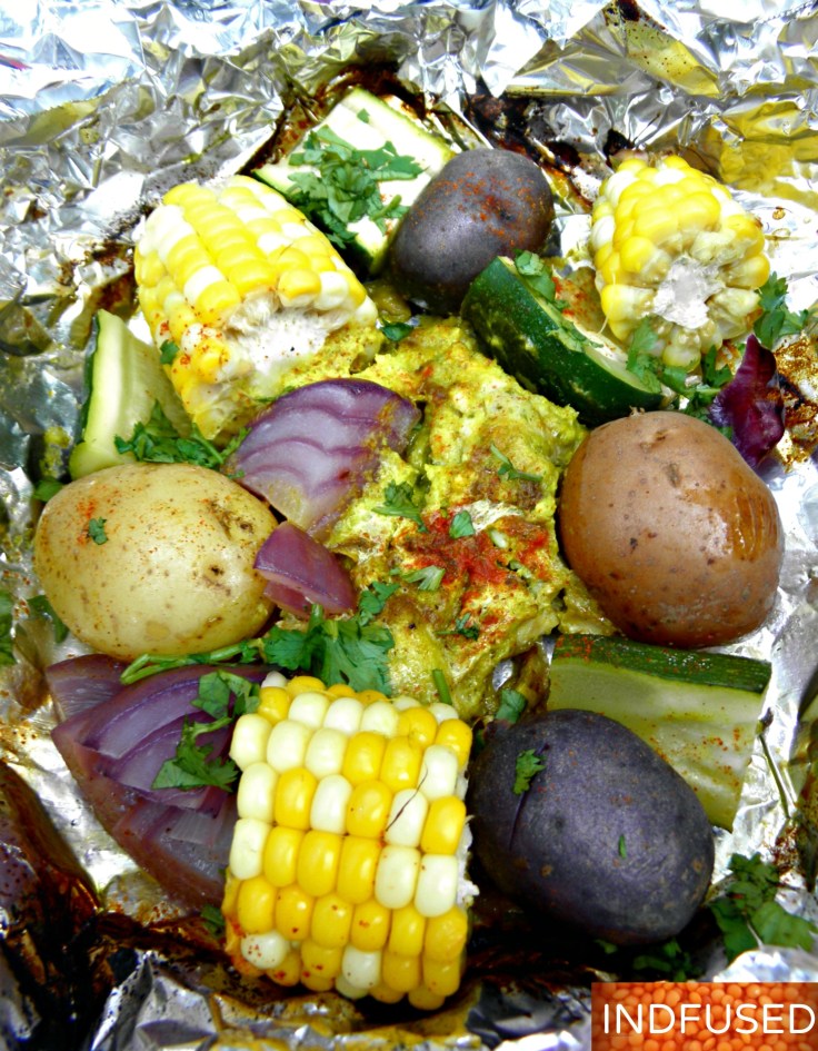 Easy recipe for Indian spiced curry chicken grilled with summer fresh veggies in aluminum foil packets.