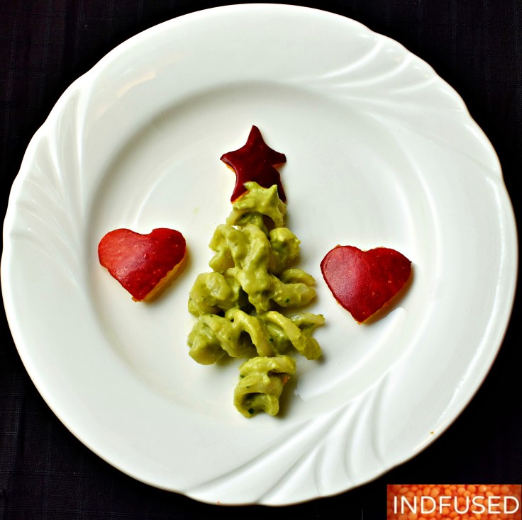 Vegetarian, gluten free, Christmas tree appetizers made with quinoa fusilli in avocado sauce